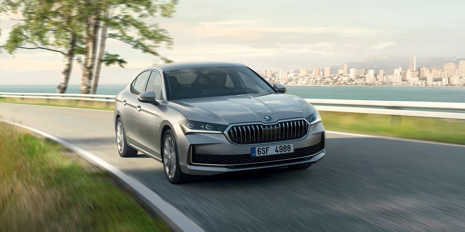 Skoda Superb silver sedan, front three-quarter driving shot