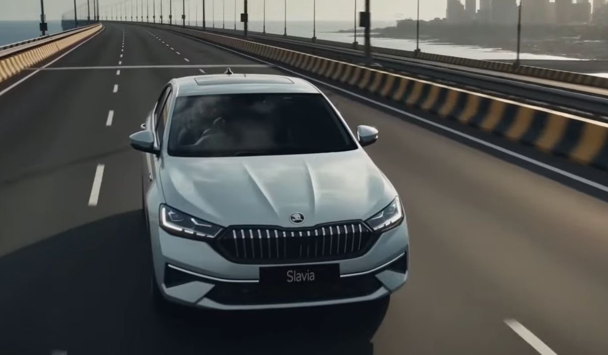 Skoda Slavia facelift white sedan, front three-quarter driving shot