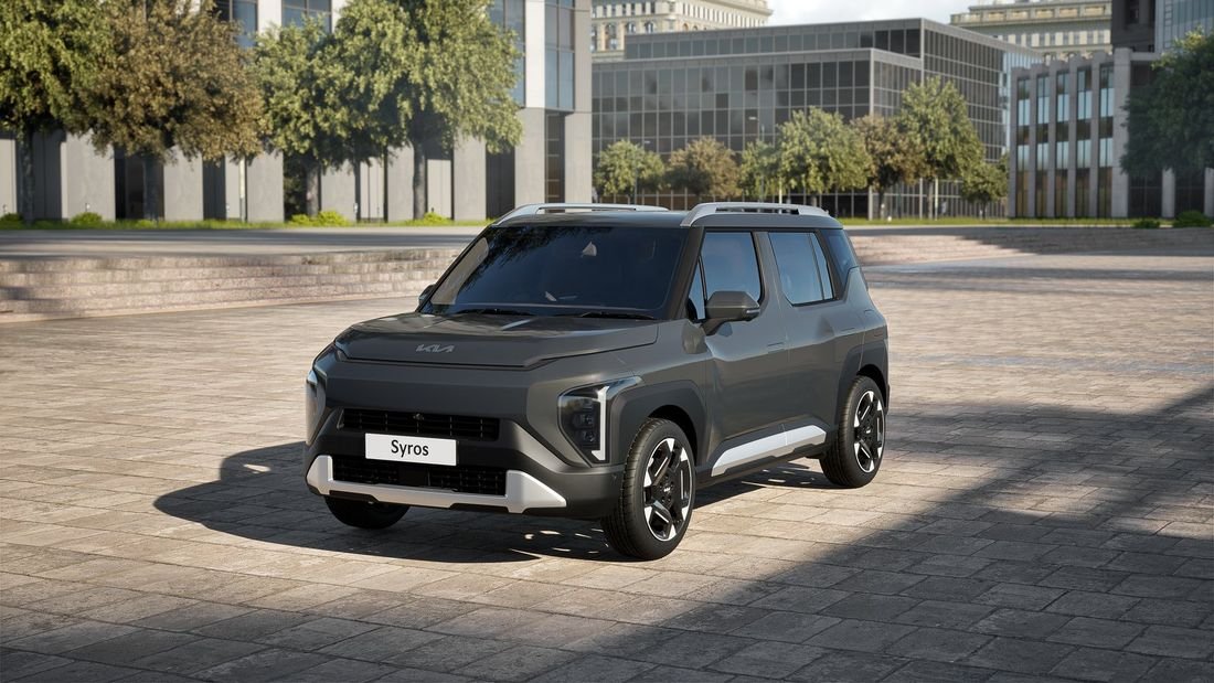 Kia Syros EV parked in a city plaza